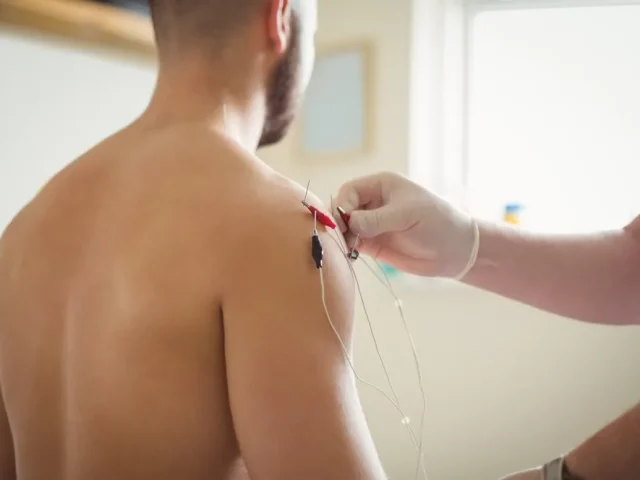 close-up-physiotherapist-inserting-needles-patient